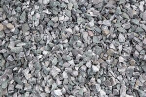 Aggregates Crushed stone texured background.