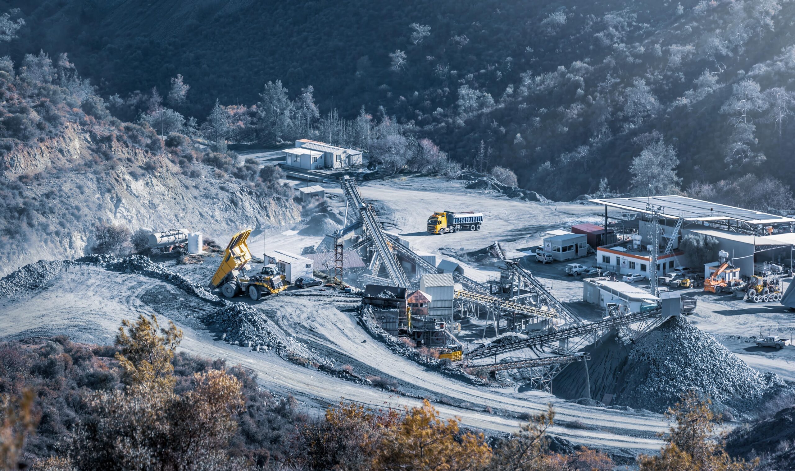 Crushing and screening plant in stone quarry at work, aerial view
